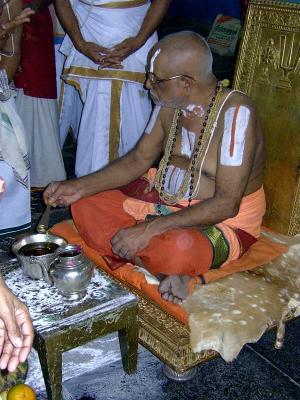 Swamy offering ShreepAda theertham to devotees-1