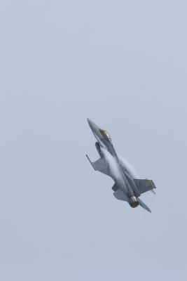 F-16 with vapor trail