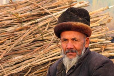 Man and stacked wood