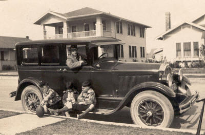 Beautiful old pic of Uncle George, Aunt Janice and grampa. My great grandfather, a professional photographer, is in car.