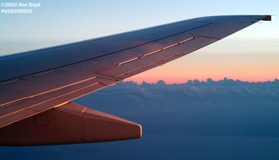 2002 - wing of Continental Airlines B737-824 at sunrise over South Florida aviation stock photo