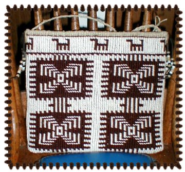 Flat bag made with Twana (Skokomish) designs featuring seals roosts and dog/grebe border.