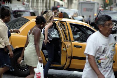 blonde with cell phone on Broadway cab
