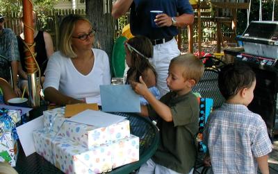 AJ opening presents with his mom (Shannon)