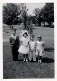 Marys First Communion with John, Mike and Mary Claire.  Maple tree in background, 1956 (441)