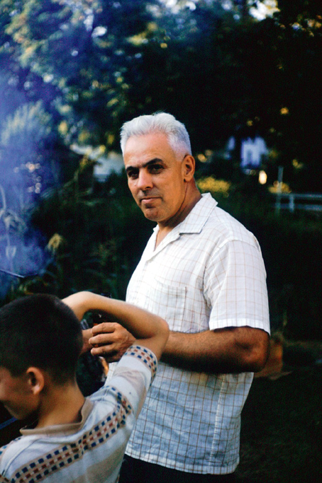 As chef at family picnic- Dan in foreground, 1963 (678)