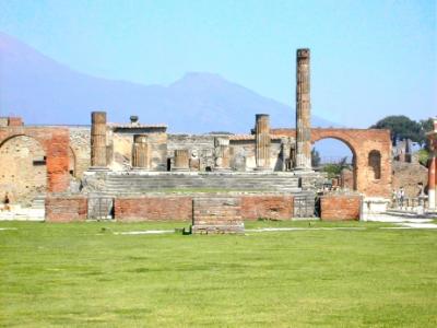 Pompeii - Forum: Temple of Jupiter. Arch of Drusus on the left.  Arch of Nero on the right. Background - part of Mt. Vesuvius.