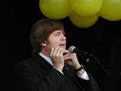 Mark demonstrates his harmonica skills.