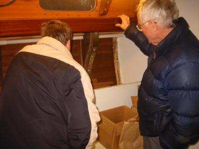 Wood lip to catch port hole condensation as well as act as a handhold