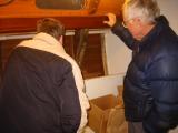 Wood lip to catch port hole condensation as well as act as a handhold