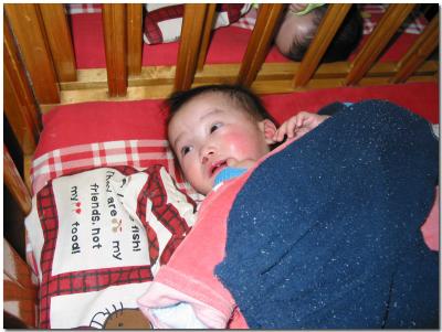 Child in crib in Anna's room