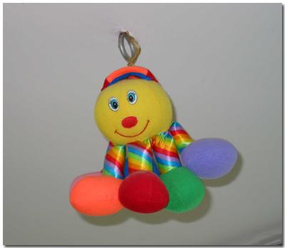 Toy hanging from ceiling above cribs