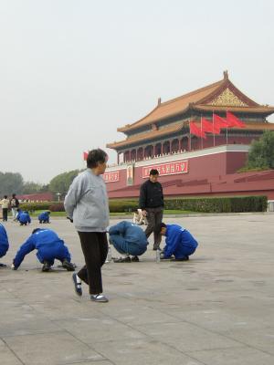 Cleaning crew in front of Forbidden City. These people where cleaning gum of the sidewake with a small pick and water. That day it was a city wide cleaning day by Volunteers.
