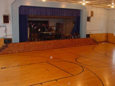 Gym is 65' wide and 43' deep (Capacity 185 patrons)
