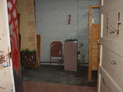 Green Room Stage Right interior (Rough condition) Note: Grounded electrical outlet at water cooler