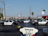 Rush hour traffic was brought to a stand-still in all directions, when officers were required to secure most of the eight-lane intersection to investigate the accident. Investigating officers, as well as the involved officer, heard from their radios that three persons, in possession of firearms, bullet-proof vests, and a large sum of cash, had been arrested at the scene of the armed bank robbery without incident. Drivers caught in the traffic snarl heard only music and traffic reports from their radios, and remained unaware that they were victims of a bank robbery several miles away.