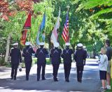 The honor guard was practicing while bystanders watched.