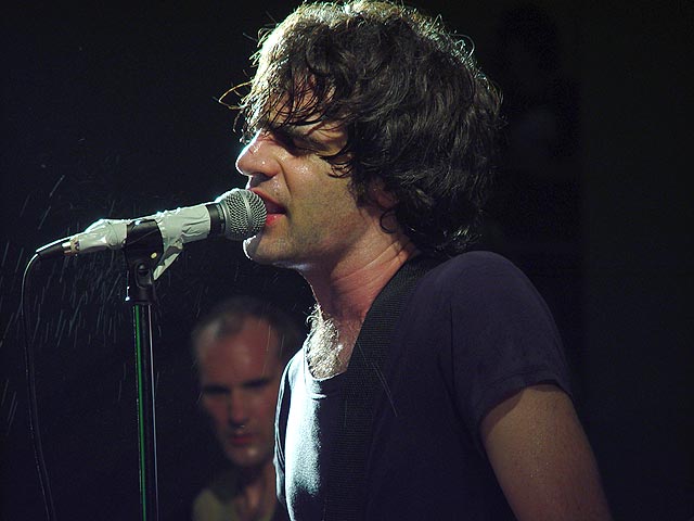 <B>Guy of Fugazi with Ian in the backround</B><br><i>by fg</i>