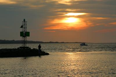 Sunset over the jetty at Menemsha, Martha's Vineyard.