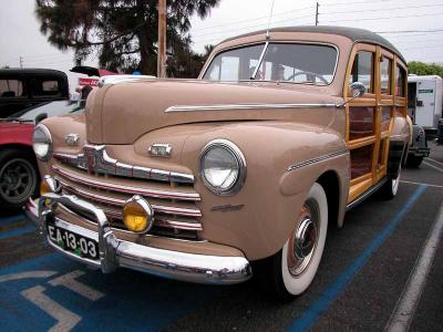  Appears to be 1946, note red striping on grille bars and rectangle park lights. Also front fender chrome is above the sculptured area. A few transition early 1947's had these carry over characteristics