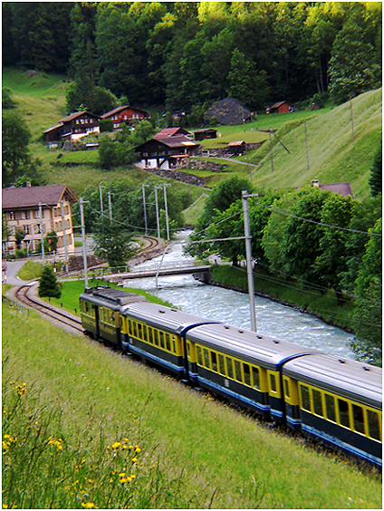 Train snakes through Lauterbrunen Valley