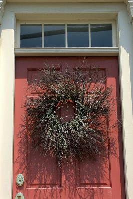 Pumpkin-Colored Door And Wreath