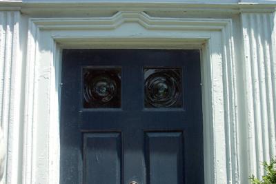 Blue Door With Bull's Eyes Glass