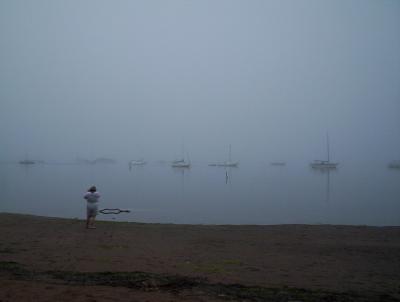 foggy boats and photographer