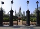 Place dArmes  with St. Louis Cathedral, Presbytere and Cabildo in background, taken from car window