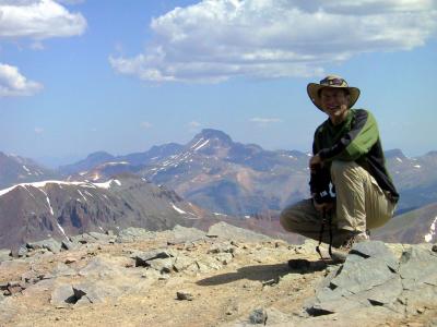 Jim on Summit of Handies....Thinking About That Uncompahgre (Background) Group....Particularly Wetterhorn