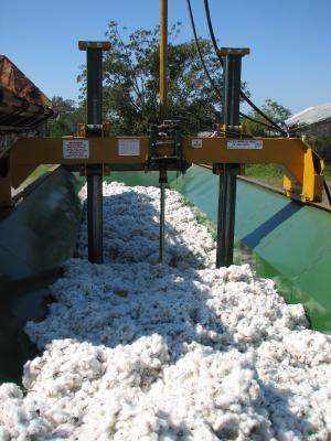 The module builder compresses the cotton into a huge block