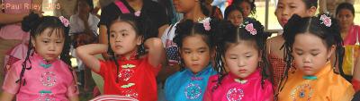 Spectators at the water melon eating contest at the NJIS fun fair