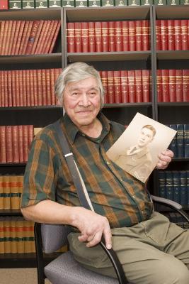 Moose Factory War Veteran Jack Wynne with a 1944 picture of himself