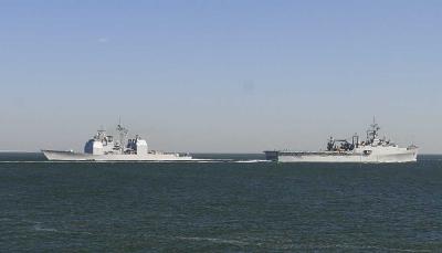USS Normandy CG60 and the USS Austin LPD4 pass in the channel