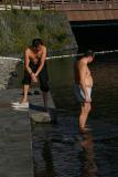 Adam and Allianz-Man prepare for swimming in the lake