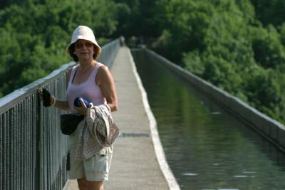 Slightly nervous wife on canal aqueduct.