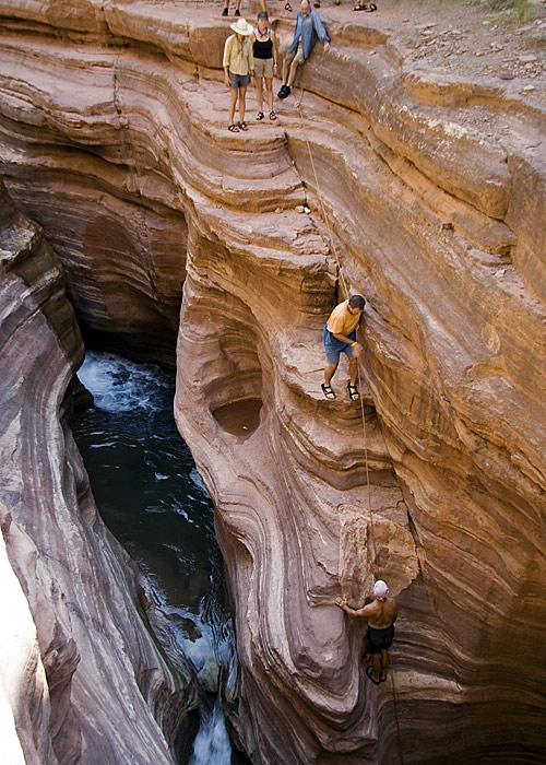 Gary climbs down to the stream (MJ)