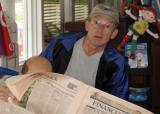 Bob reads the paper over Clives shoulder