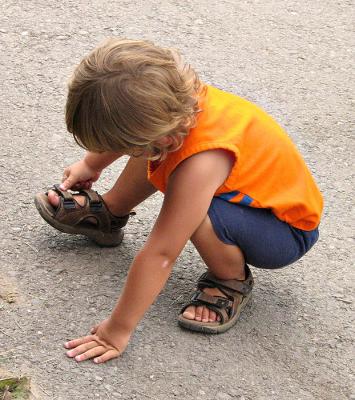 Stopped to Fasten a Sandal