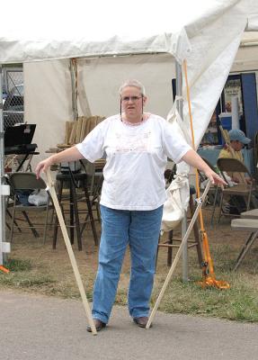 Woman With Walking Sticks