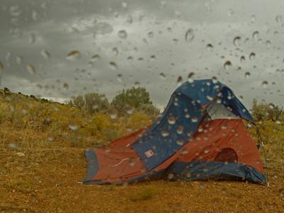 Tom's tent buckling in the wind - we planned Coyote Butte South but the flash flood potential forced our hand...we're on to Zion
