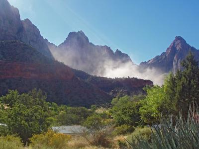 Dust cloud from rockfall above Watchman Trail