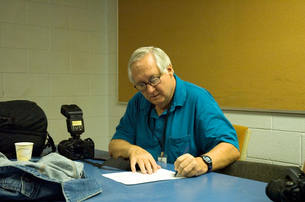 Robin Signing his Paper Work.