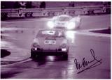 Vic Elford at the wheel of 917 Long Tail #25 and setting to pass a Porsche 911 in the rain