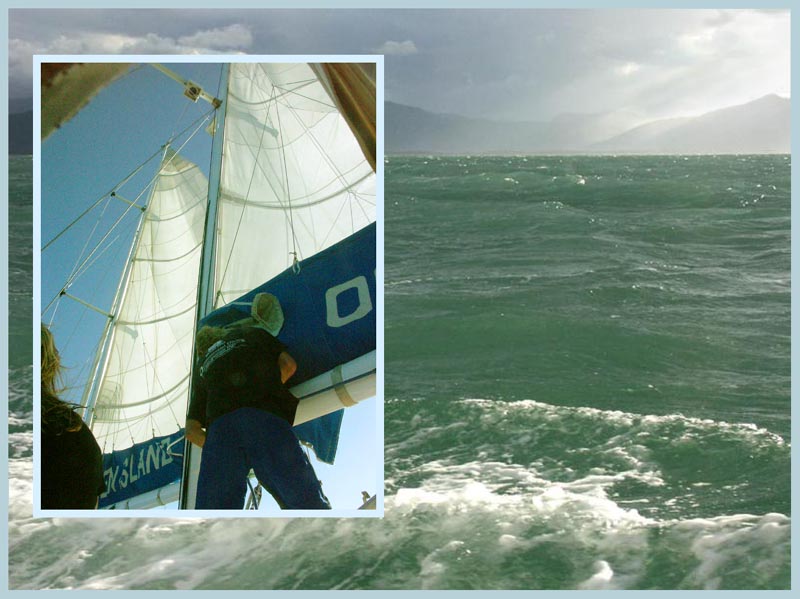 Putting up the sails on Ocean Free
