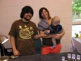 Mike and Nicole Gong with little Miles diggin daddys art