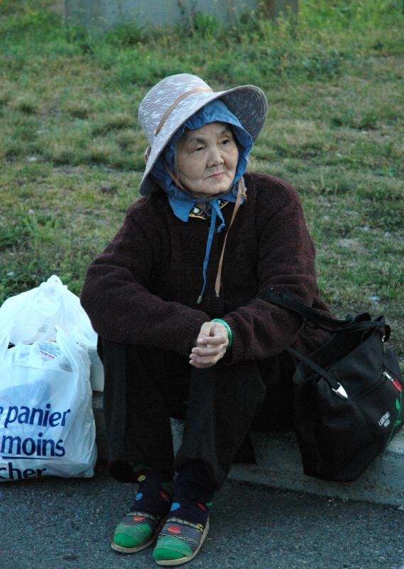 old woman is waiting