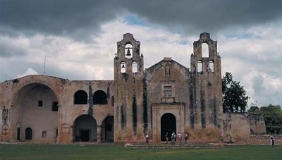 Mayan open-walled church on left