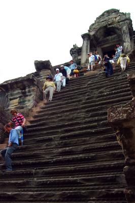 Climbing the Angkor Wat main sanctum...