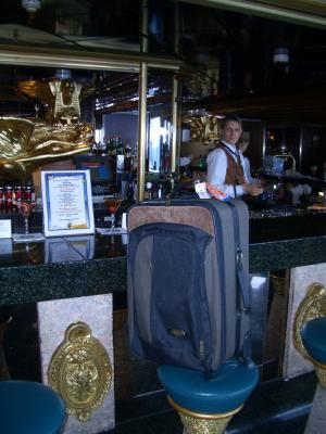 Suitcase enjoys a nice drink